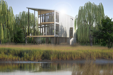 Inspiration for a mid-sized contemporary gray two-story metal house exterior remodel in Charlotte with a shed roof and a metal roof