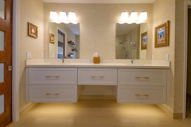 Inspiration for a mid-sized modern master beige tile and porcelain tile wood-look tile floor, beige floor, double-sink and wallpaper walk-in shower remodel in Other with white cabinets, a bidet, beige walls, an undermount sink, quartz countertops, a hinged shower door, beige countertops and a floating vanity