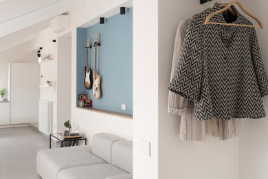 Ispirazione per un soggiorno nordico stile loft con pareti bianche, pavimento in gres porcellanato e pavimento grigio