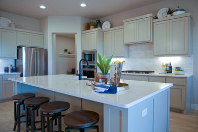 Kitchen - large contemporary l-shaped kitchen idea in Austin with quartz countertops, white backsplash, porcelain backsplash and white countertops