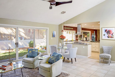 Living room - mid-sized contemporary open concept porcelain tile, beige floor and vaulted ceiling living room idea in Albuquerque with beige walls, a standard fireplace, a tile fireplace and no tv