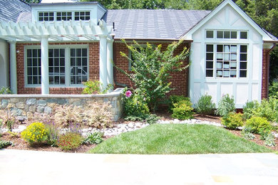 Inspiration for a large traditional full sun front yard stone garden path in DC Metro.