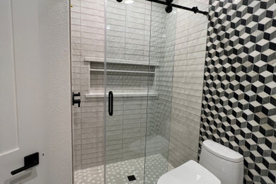 Mid-sized trendy kids' beige tile and porcelain tile pebble tile floor and double-sink alcove shower photo in Sacramento with shaker cabinets, white cabinets, a two-piece toilet, quartz countertops, a hinged shower door and a freestanding vanity