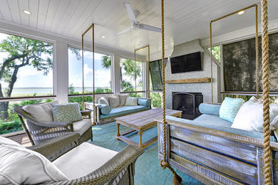 Beach style screened-in back porch photo in Charleston