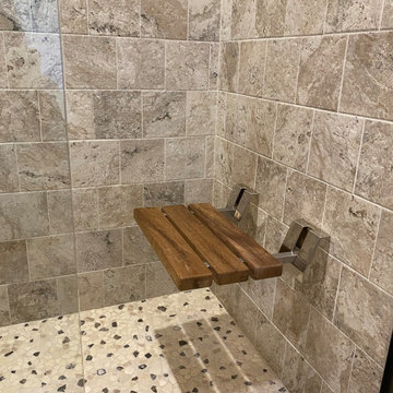 Teak wood foldable shower seat in custom tile shower