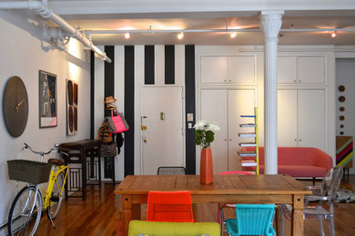 Example of a mid-sized eclectic dark wood floor and brown floor kitchen/dining room combo design in Kansas City with white walls and no fireplace