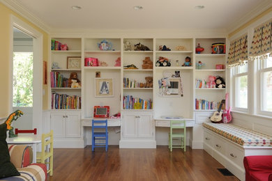 Design ideas for a mid-sized traditional gender-neutral kids' playroom in Manchester with yellow walls.