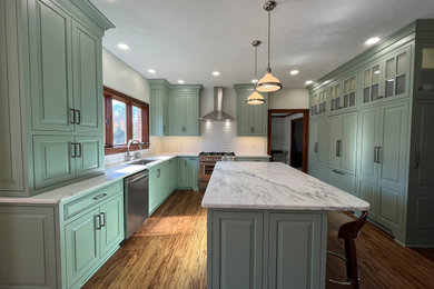 Kitchen pantry - large french country u-shaped medium tone wood floor and brown floor kitchen pantry idea in Indianapolis with an undermount sink, beaded inset cabinets, quartzite countertops, white backsplash, ceramic backsplash, stainless steel appliances, an island and white countertops