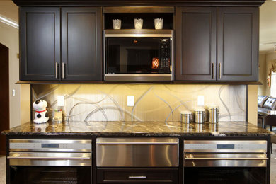 Mid-sized trendy u-shaped dark wood floor eat-in kitchen photo in Cedar Rapids with an undermount sink, shaker cabinets, dark wood cabinets, granite countertops, stainless steel appliances and an island