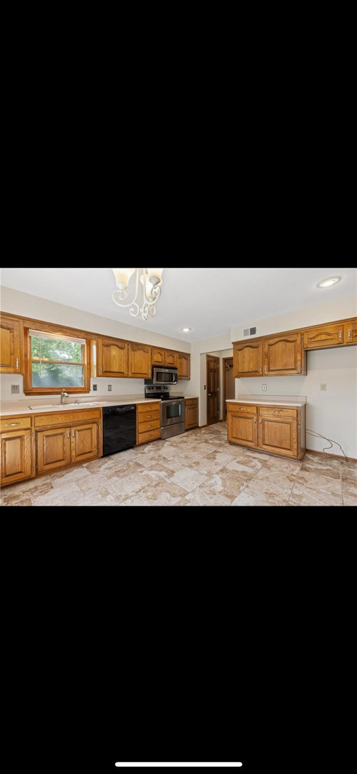 How much oak trim should I paint white in our 80s built home?