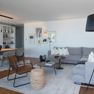Parque das Nações living room with sectional sofa, shelving and dining view