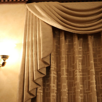 Swags overlaying pinch pleated curtains