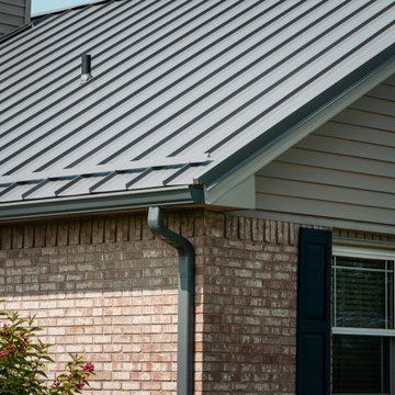 Grey Metal Roof & Gutters and Downspout