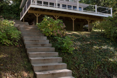 Inspiration for a small coastal green two-story wood exterior home remodel in Other with a shingle roof