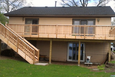 Inspiration for a large craftsman backyard deck remodel in Minneapolis with no cover
