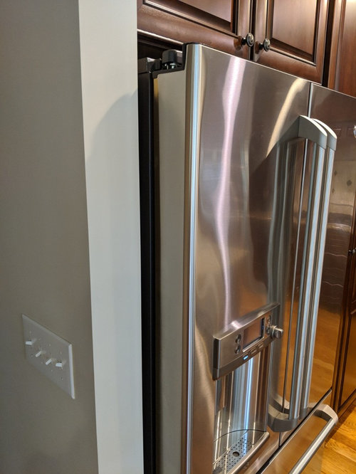 Refrigerator next to wall hinges?
