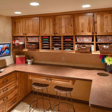 Rustic craft room and gift wrapping station with rustic Shaker style hickory cab