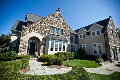 Example of a tuscan exterior home design in Boston