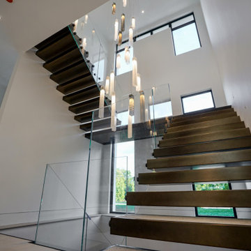 Statement glass chandelier in double high space
