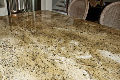 Kitchen - kitchen idea in Birmingham with granite countertops and an island