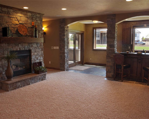 Eclectic Basement Wichita Mid-sized trendy basement photo in Wichita with beige walls, carpet and a stone