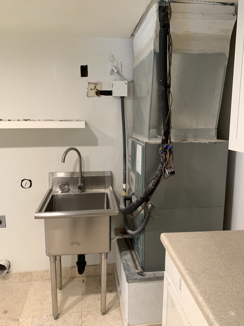 How can I hide this unseemly HVAC unit in my laundry room?