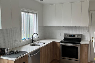 Kitchen - modern kitchen idea in Montreal