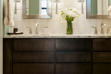 Design ideas for a bathroom in Chicago with flat-panel cabinets, dark wood cabinets, white tile and an undermount sink.