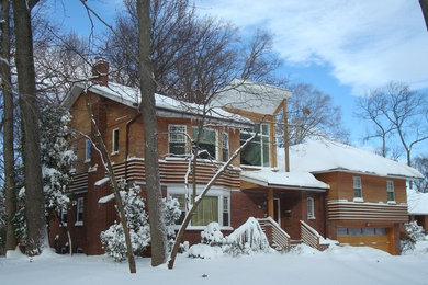 Mid-sized minimalist split-level wood exterior home photo in New York with a hip roof