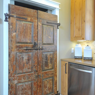 Mid-sized farmhouse kitchen pantry photos - Example of a mid-sized country l-shaped medium tone wood floor kitchen pantry design in Tampa with a farmhouse sink, recessed-panel cabinets, medium tone wood cabinets, concrete countertops, multicolored backsplash, stone tile backsplash, stainless steel appliances and an island