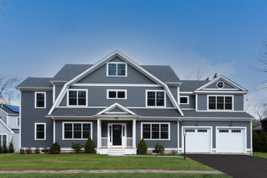 Inspiration for a large transitional grey house exterior in Boston with four or more storeys, concrete fiberboard siding, a gambrel roof, a shingle roof, a grey roof and clapboard siding.