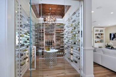 Large transitional light wood floor wine cellar photo in Los Angeles