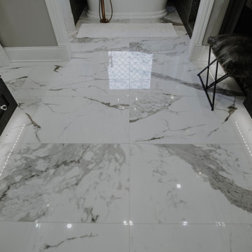 Heated floor by Schluter with programmable thermostat.