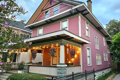Huge elegant purple two-story wood and clapboard house exterior photo in Jacksonville