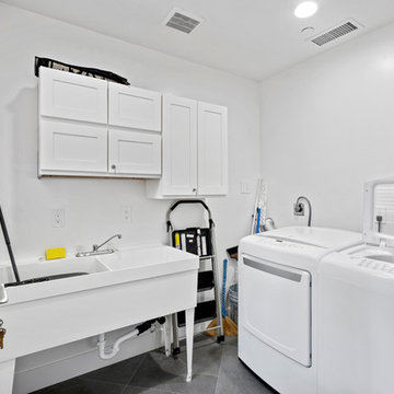 Accessible Laundry Room with Utility Sink and White Cabinetry | Novato