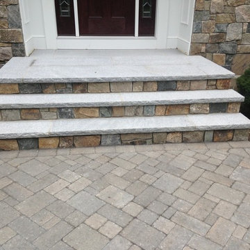 Stone exterior with front steps and walkway