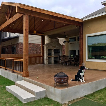 Gable Cover with Decorative Concrete Patio and Stone Grill/Fireplace