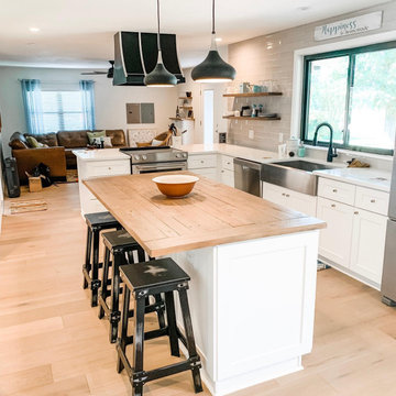 Farmhouse Kitchen remodel, white cabinets, butcher block island, glass tile back