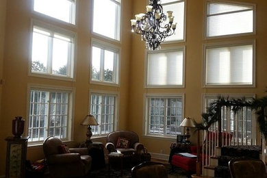 Dramatic before and after of a 24' high bank of great room windows