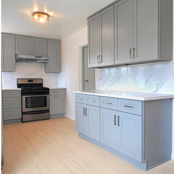 Modern Gray Shaker Kitchen Remodel with White Quartz Countertops