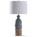 Stylecraft - Bampton Embossed Shell and Starfish Table Lamp With Rope Detail and Drum Shade - A coastal style table lamp that garners so much appeal from its textural design. A nautical rope adorns the blue ceramic frame, giving the glass and polyresin structure intriguing depth within its coastal theme. The linen and polyester shade is white with a tan vertical striped pattern, bringing a liveliness to a piece that's perfect for foyers, living rooms and offices.