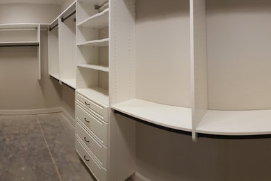 Inspiration for a large contemporary closet remodel in Other