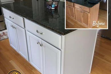 Example of a mid-sized classic u-shaped eat-in kitchen design in Boston with gray cabinets and an island