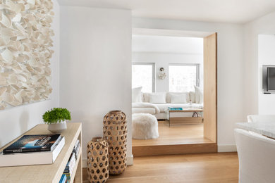 Kitchen/dining room combo - mid-sized scandinavian light wood floor and beige floor kitchen/dining room combo idea in New York with white walls