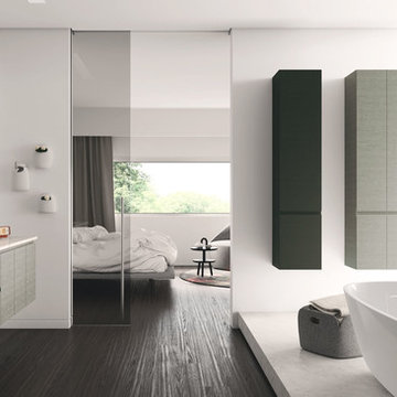 Modern grey and black bathroom with dark wood floors