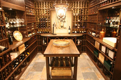 Mid-sized traditional wine cellar in New York with storage racks and multi-coloured floor.