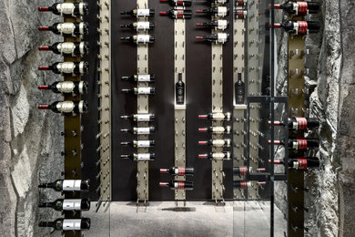Example of a mountain style wine cellar design in Vancouver