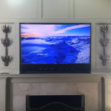 Recessed TV & Custom Soundbar over fireplace