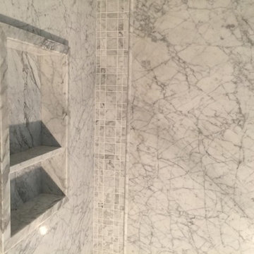 8mm thin slab white Carrara mable shower with matching caddy, tile, pencil trim