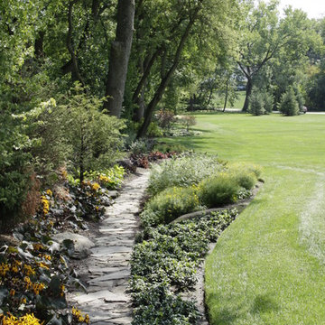 Full Landscape with Patio, Outdoor Kitchen, Stone Driveway and Planting